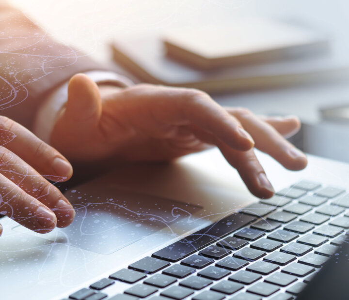 PSD2 SCA-Telco-person typing on keyboard-header-1600x1667