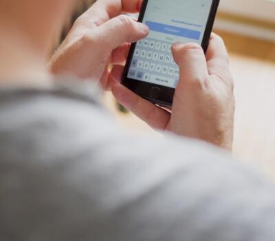 Why Callsign-person holding phone-content-830x700