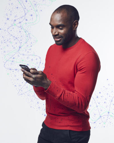 account takeover (ATO)-man standing with phone-content-800x1000.jpg