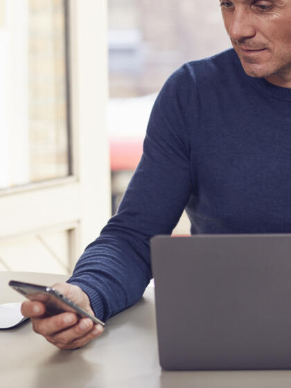 Online payments and transactions-man with laptop and phone-content-800x1000