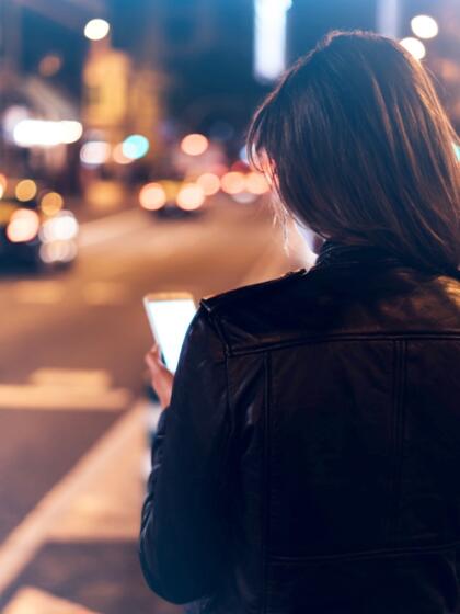 Solutions-women checking phone traffic-content-840x1120