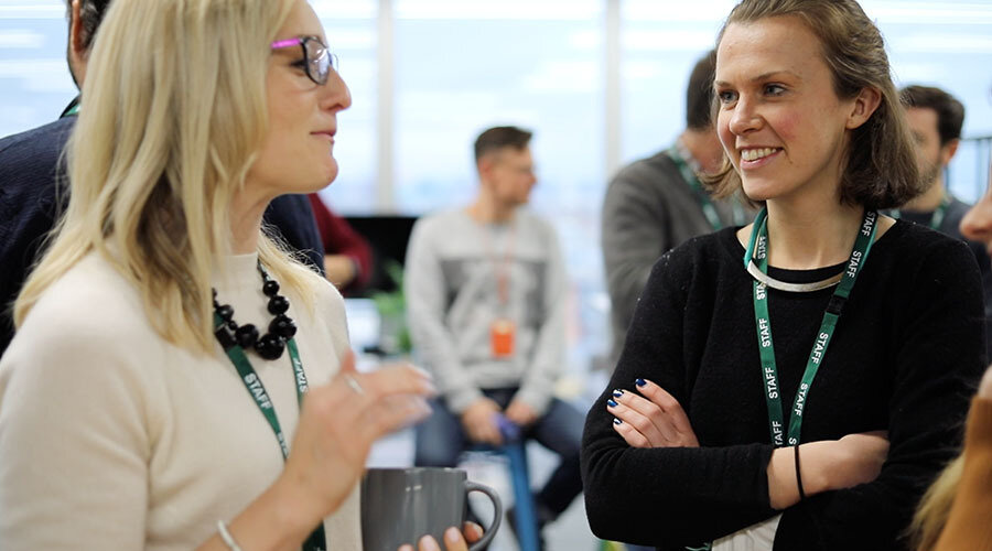 Careers-two employees chatting-content-900x500